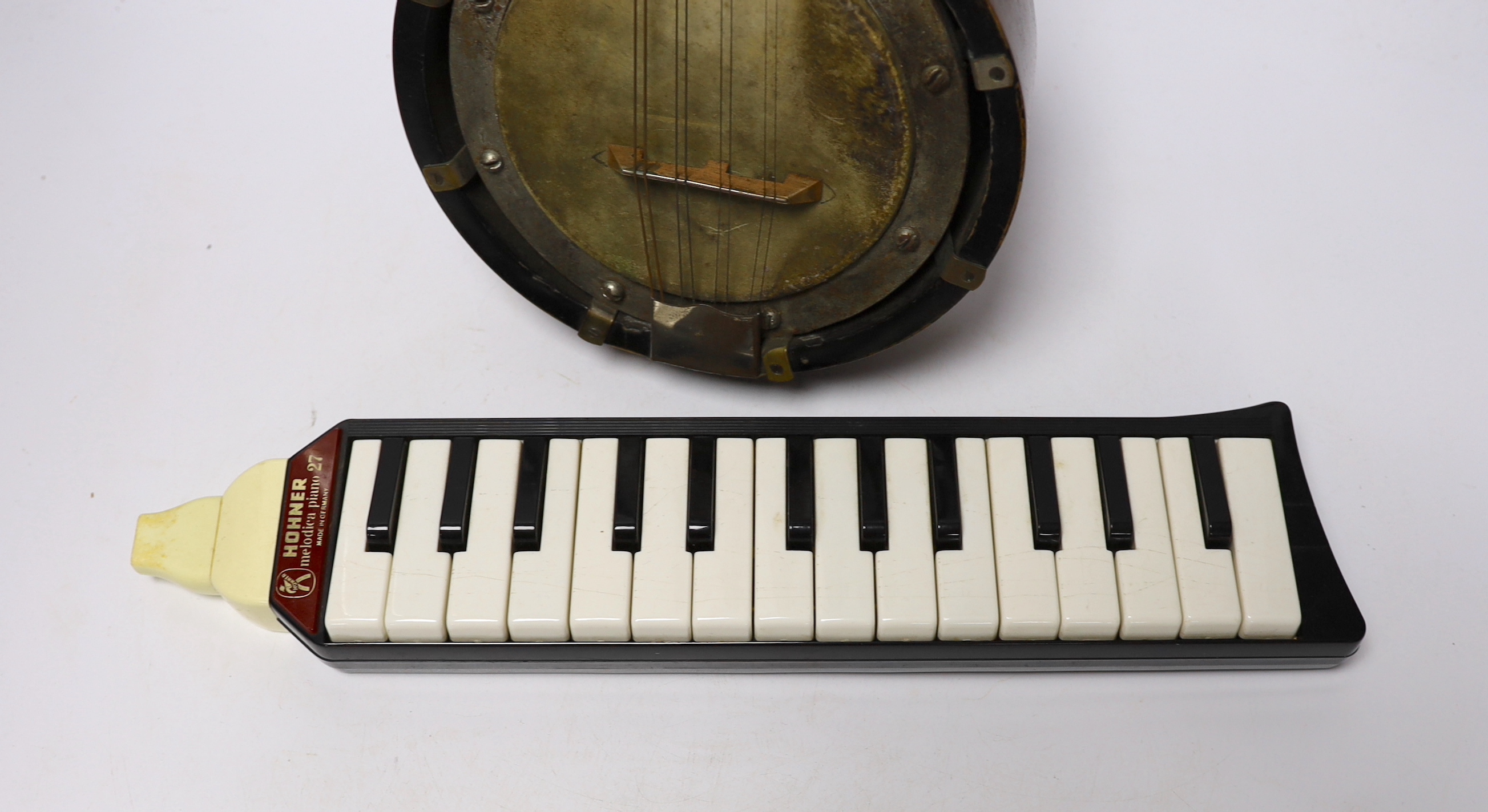 A John Grey and sons, London eight string banjolele in original case and a Hohner melodica